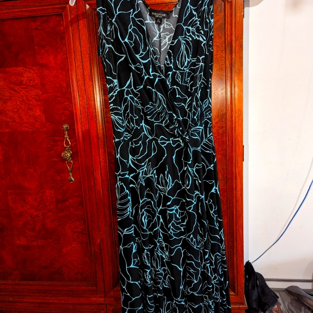 Selling a nice sheer dress with black and turquoise design